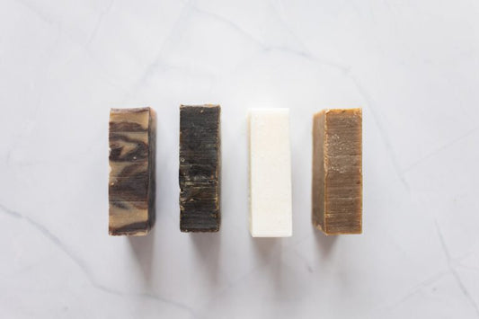 Four organic soap bars lined up