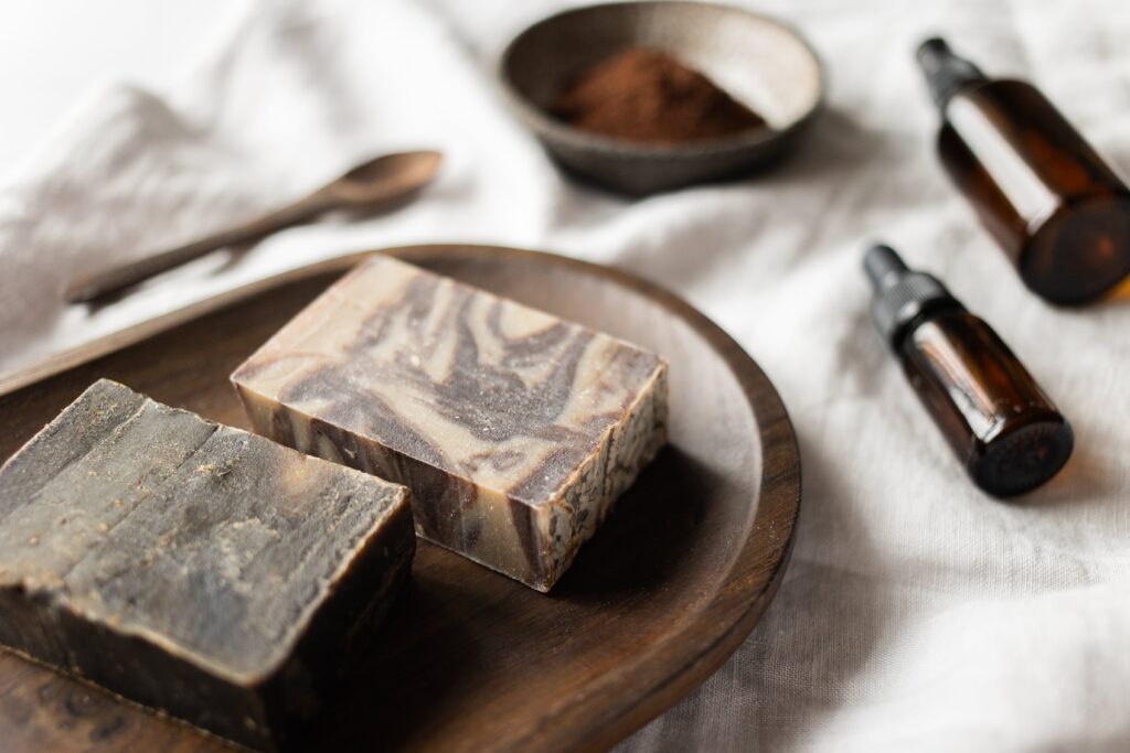Two natural soap bars and two essential oils